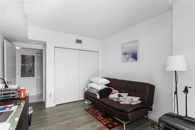 living room with dark hardwood / wood-style flooring