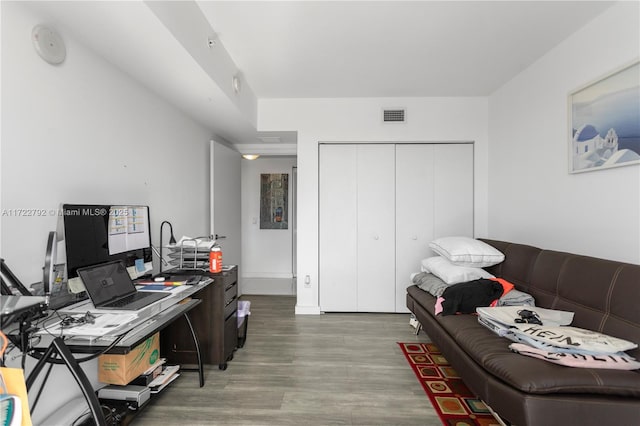 office space with wood-type flooring