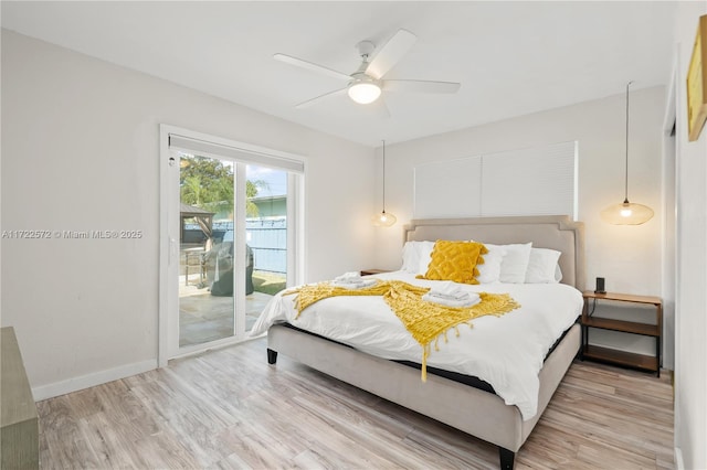 bedroom featuring access to exterior, ceiling fan, and light hardwood / wood-style flooring