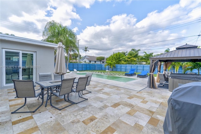 view of patio featuring a gazebo, grilling area, and a swimming pool with hot tub