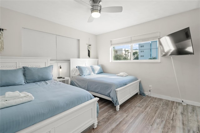 bedroom featuring ceiling fan and light hardwood / wood-style floors