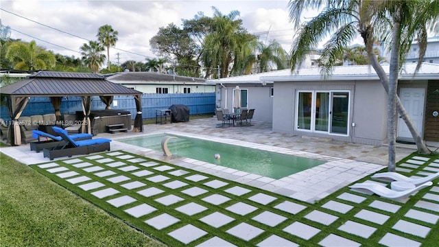 view of swimming pool featuring a gazebo, a grill, a patio, and a hot tub