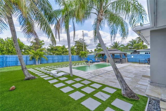 view of swimming pool with a gazebo, a patio area, a yard, and pool water feature