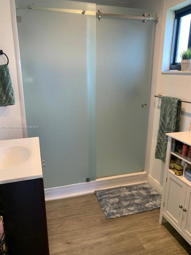 bathroom featuring vanity and hardwood / wood-style flooring