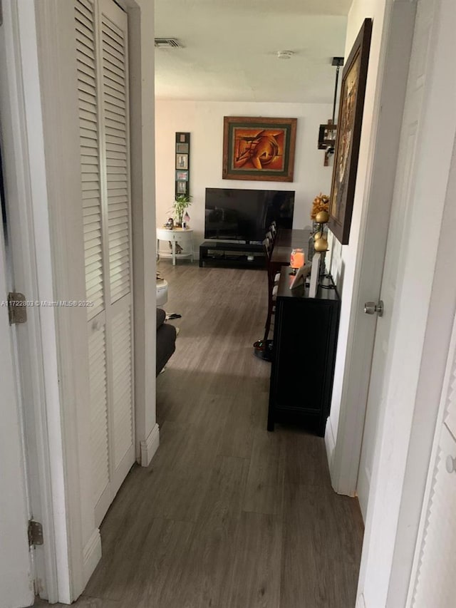 hallway featuring dark wood-type flooring