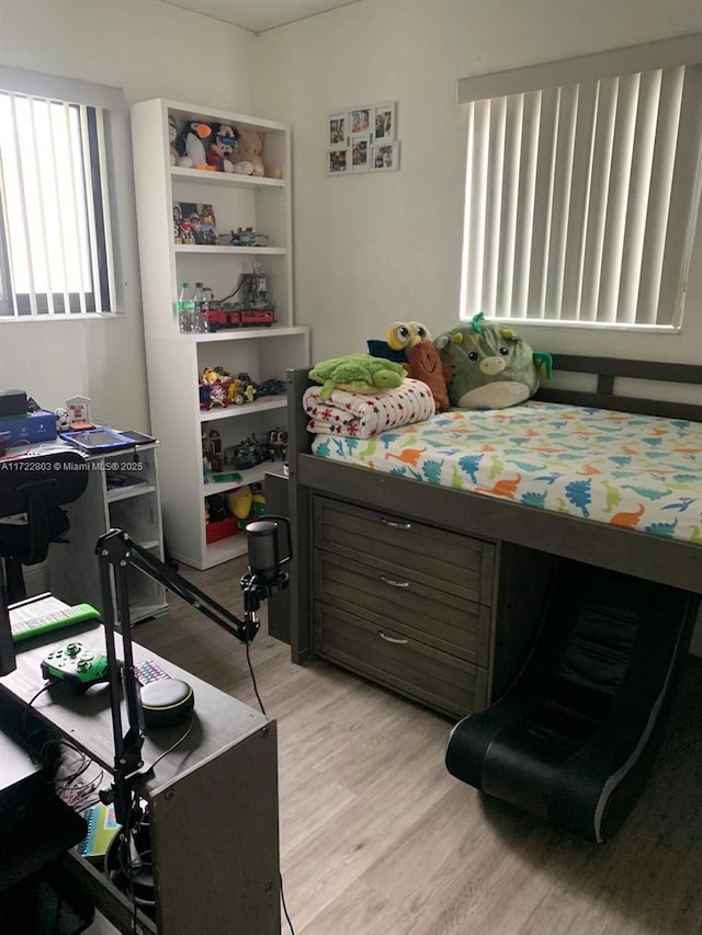 bedroom with light hardwood / wood-style flooring