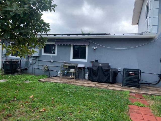 rear view of house with a yard