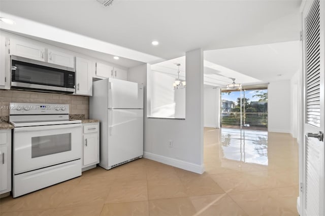 kitchen with white cabinetry, an inviting chandelier, pendant lighting, white appliances, and decorative backsplash