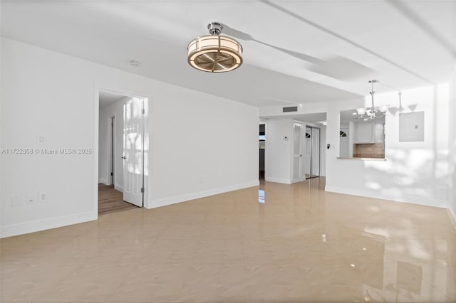 unfurnished living room featuring a notable chandelier and electric panel