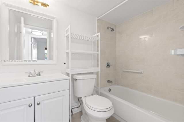 full bathroom featuring toilet, vanity, and tiled shower / bath