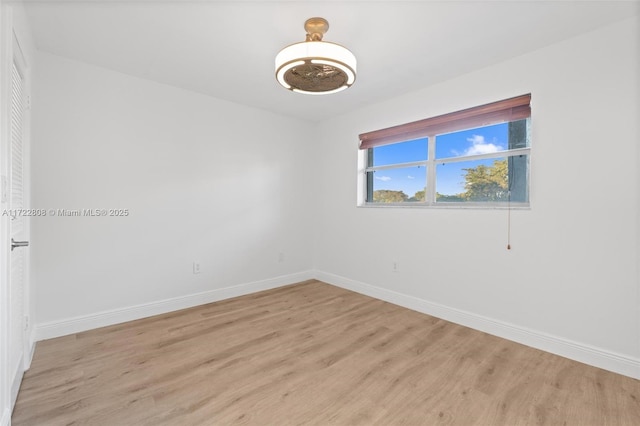 spare room featuring light hardwood / wood-style floors