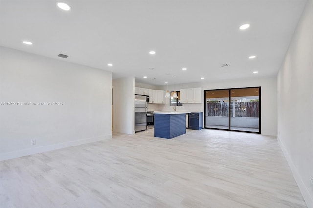 unfurnished living room featuring light wood-type flooring