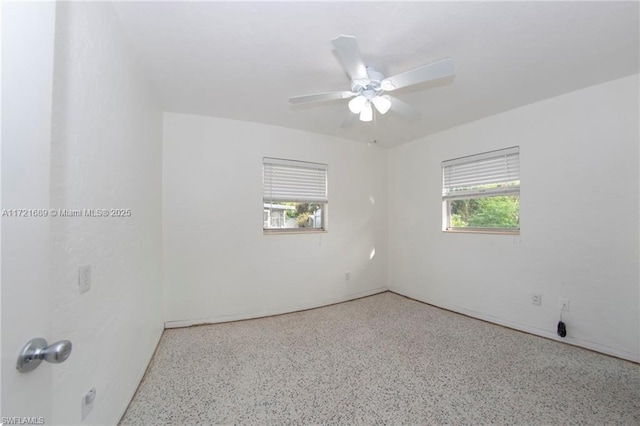 empty room featuring ceiling fan