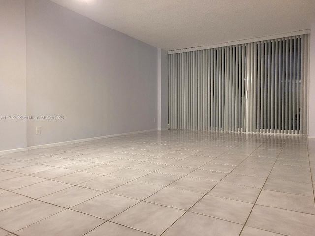 empty room featuring light tile patterned floors