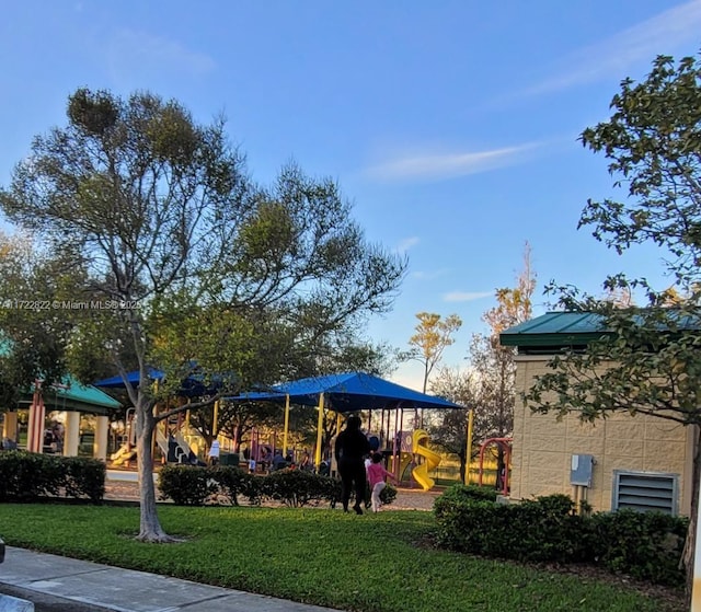 view of jungle gym featuring a lawn