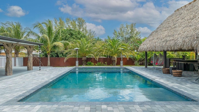 view of swimming pool featuring a gazebo and a patio