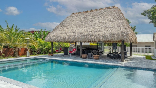 view of swimming pool featuring a gazebo and a patio