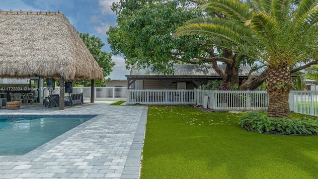 view of pool featuring a gazebo, a patio area, and a lawn