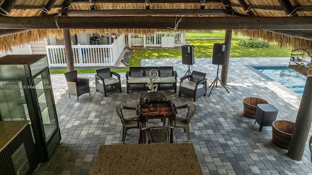 view of patio / terrace with an outdoor living space and a swimming pool