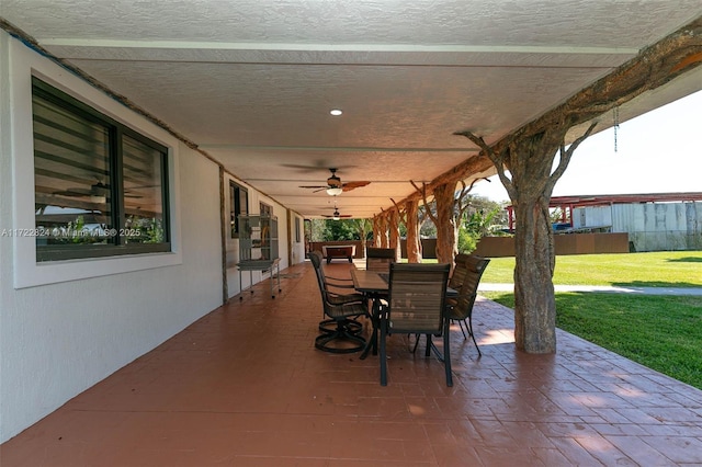 view of patio featuring ceiling fan