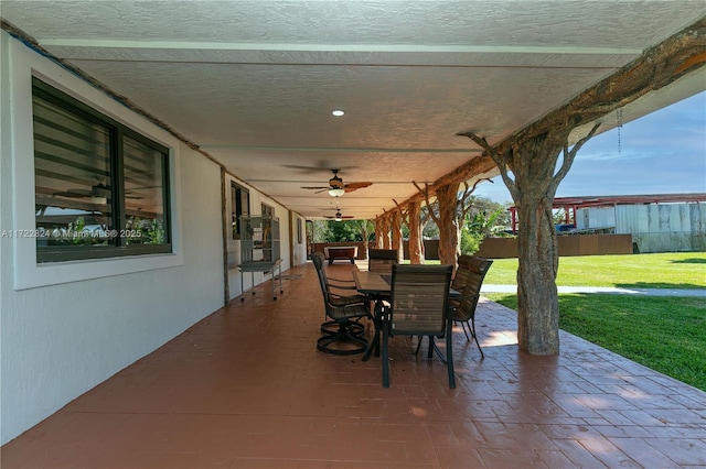 view of patio featuring ceiling fan