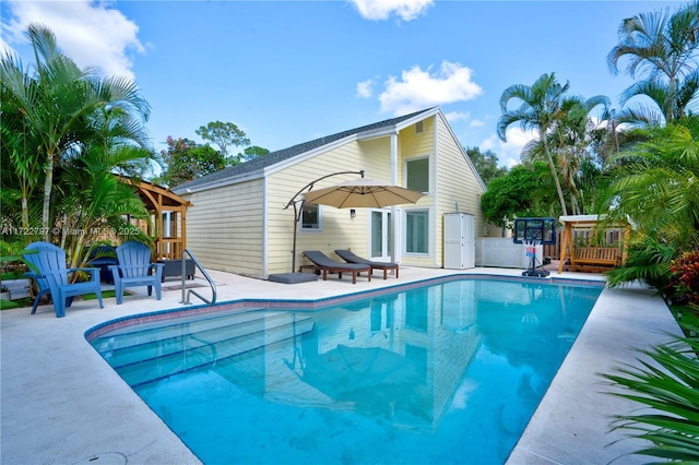 view of pool featuring a patio area