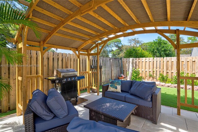 view of patio with grilling area and outdoor lounge area