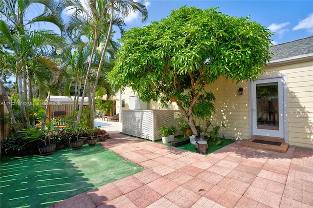 view of patio / terrace featuring fence