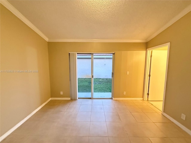 spare room with light tile patterned flooring, a textured ceiling, and ornamental molding