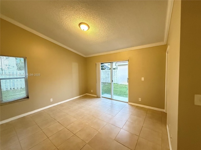 empty room with light tile patterned floors, a textured ceiling, and ornamental molding