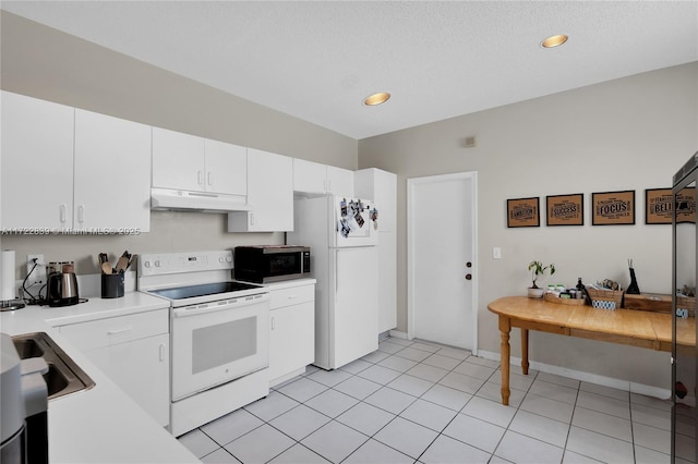 kitchen featuring white cabinetry, sink, a textured ceiling, white appliances, and light tile patterned floors