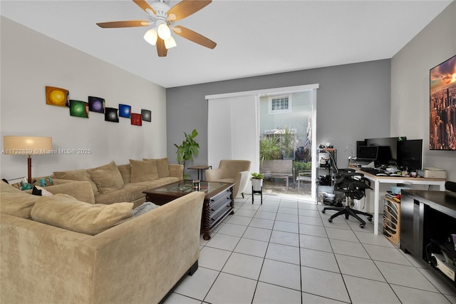 tiled living room with ceiling fan