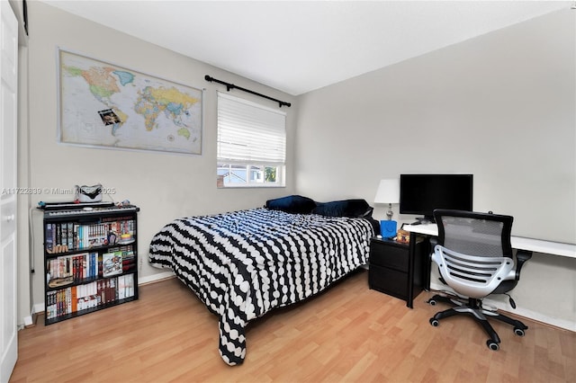 bedroom featuring wood-type flooring