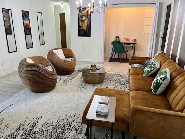 sitting room featuring hardwood / wood-style floors and a chandelier