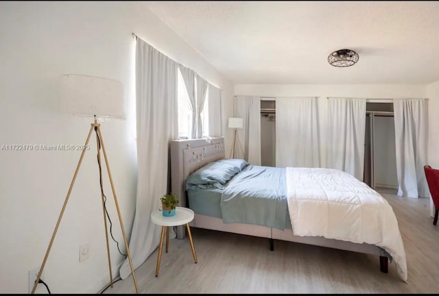 bedroom with hardwood / wood-style floors