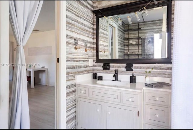 bathroom featuring hardwood / wood-style floors and vanity