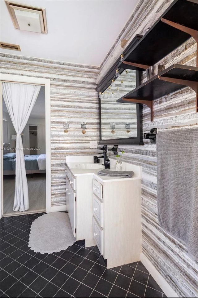 bathroom with tile patterned flooring and vanity