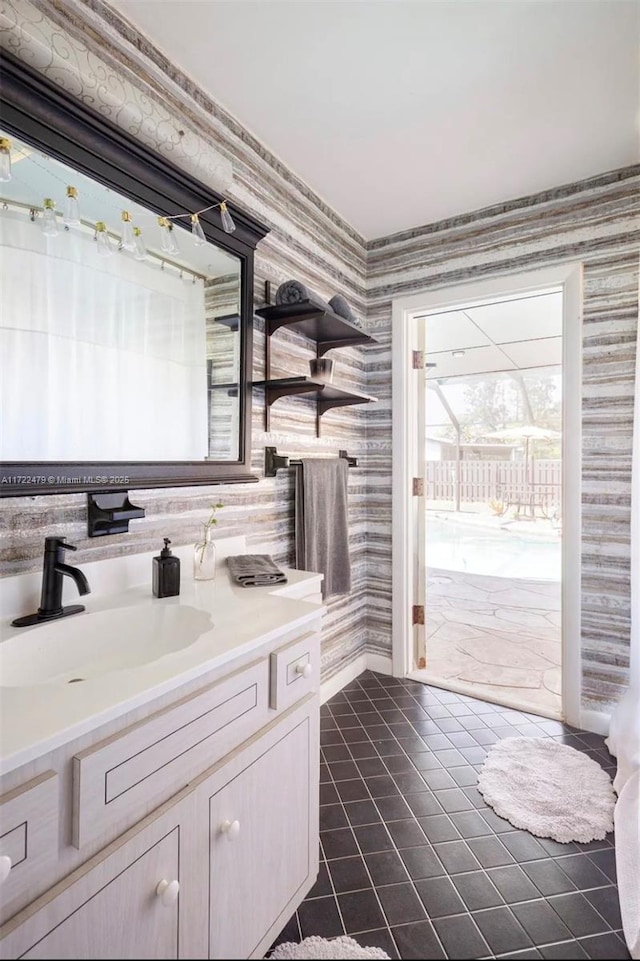 bathroom with tile patterned flooring and vanity