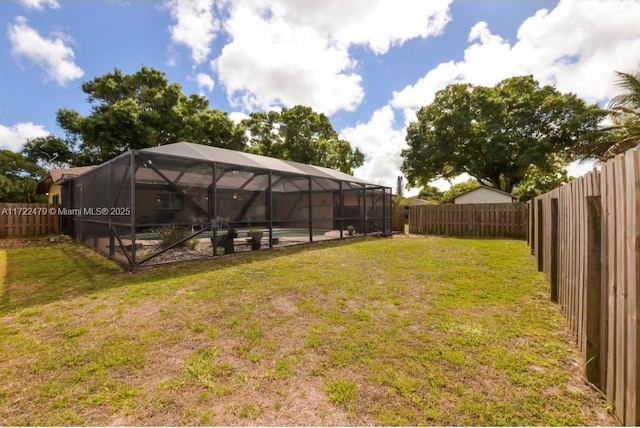 view of yard with a lanai