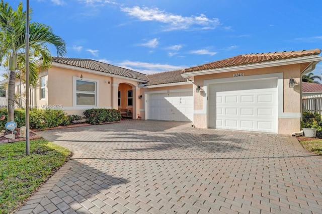 mediterranean / spanish-style home featuring a garage