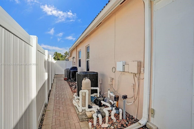 view of side of property featuring central AC unit