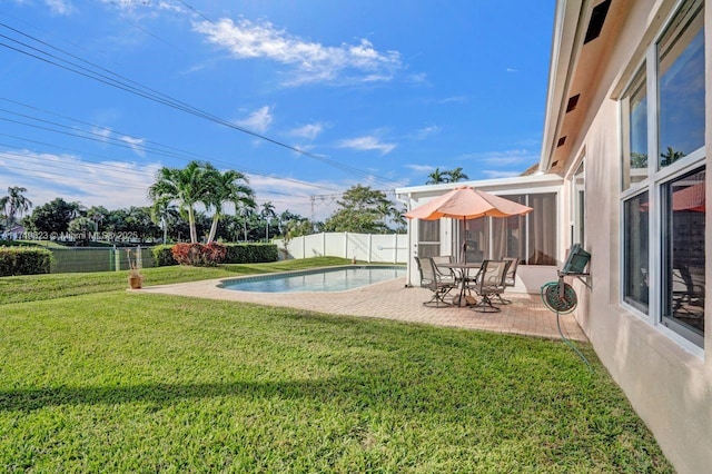 view of yard with a patio area and a fenced in pool