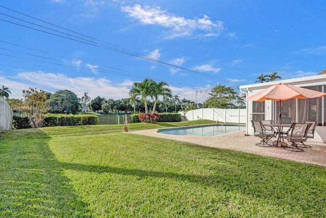 view of yard featuring a fenced in pool and a patio area