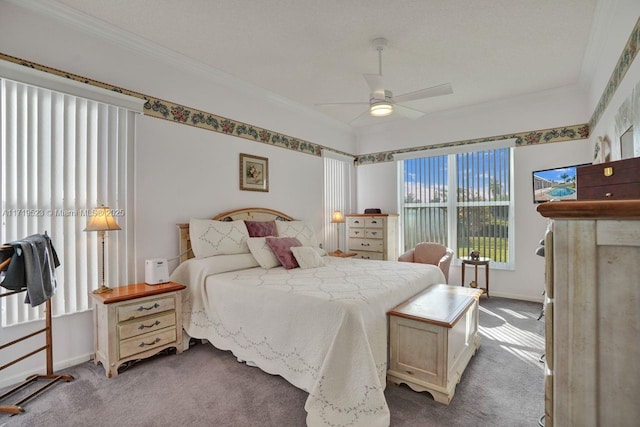 bedroom featuring ceiling fan, crown molding, and carpet floors