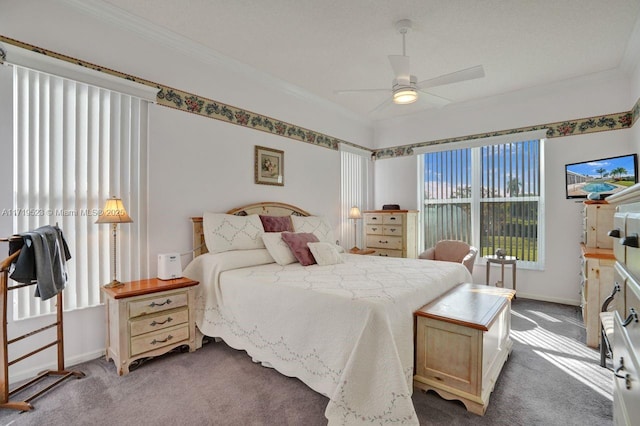 bedroom featuring ceiling fan, crown molding, and carpet floors