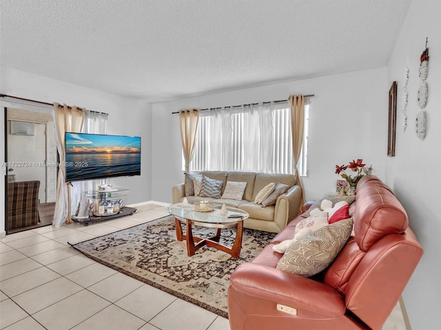 tiled living room featuring a textured ceiling