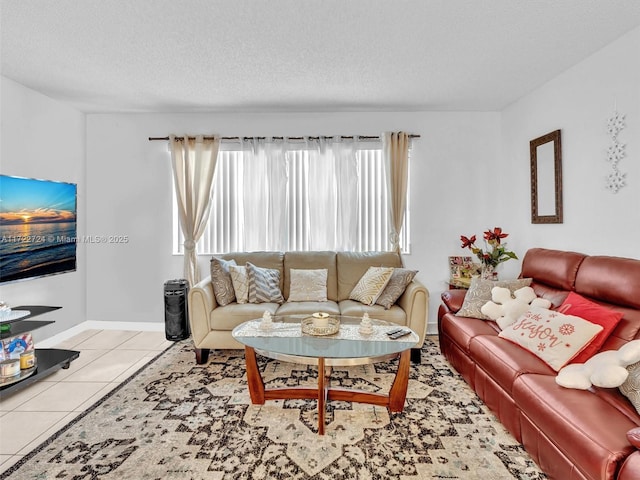 living room with light tile patterned floors and a textured ceiling