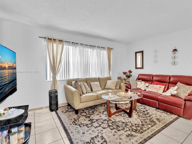 living room featuring light tile patterned floors and a textured ceiling