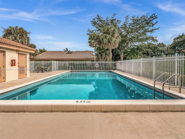 view of swimming pool with a patio area