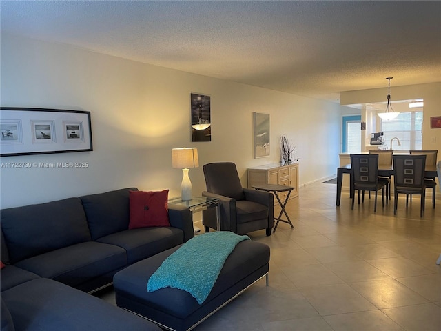 living room with sink and a textured ceiling